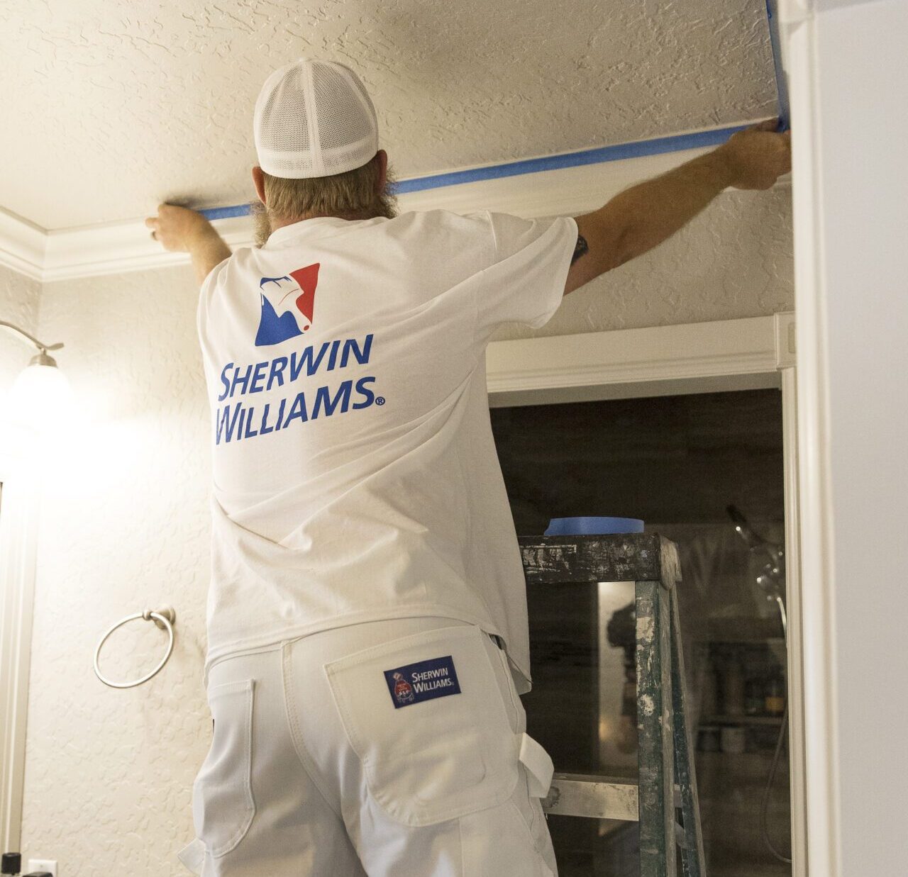 A man measuring wall length